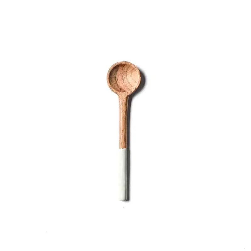 Wooden spoon with a white handle on a white background
