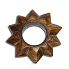 A carved wooden star-shaped ring with a natural brown wood grain finish, photographed on a clean white background.