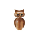 Wooden owl figurine on a white background