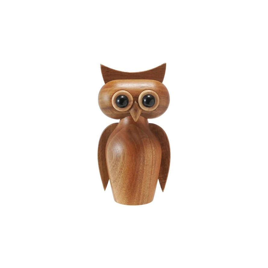 Wooden owl figurine on a white background