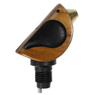Wooden and black bird-shaped object on a white background